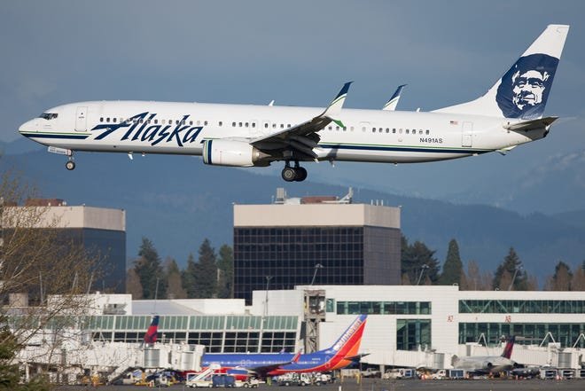 An Alaska Airlines Boeing 737-900 lands at Seattle Tacoma International Airport in March, 2019. Jeremy Dwyer-Lindgren/Special To USA TODAY