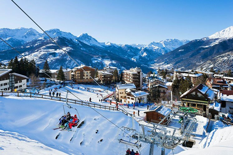BHYFNE View from the bottom of the slopes towards the old town, Sauze d'Oulx, Milky Way ski area, Italy