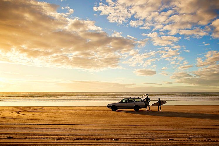 Golden sands and rolling waves make New Zealand's Ninety Mile Beach an irresistible spot to surf until sundown © Amos Chapple / Lonely Planet Images / Getty Images