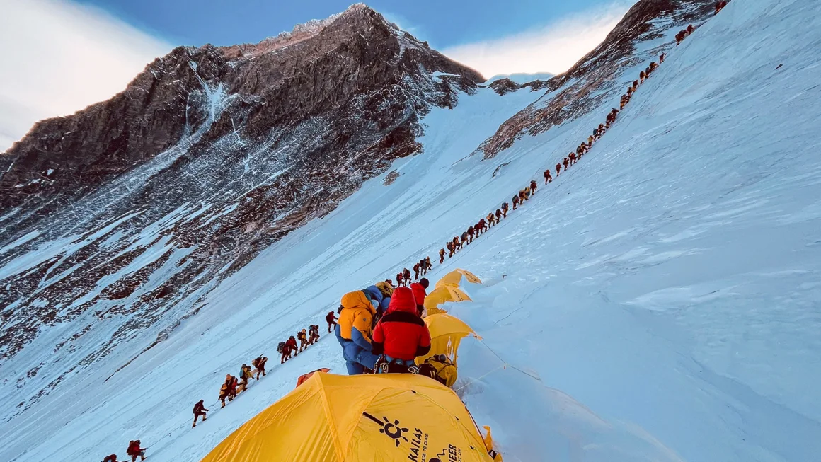 This photograph from 2021 shows mountaineers lined up as they climb a slope during their ascent to summit Mount Everest. Lakpa Sherpa/AFP/Getty Images/File